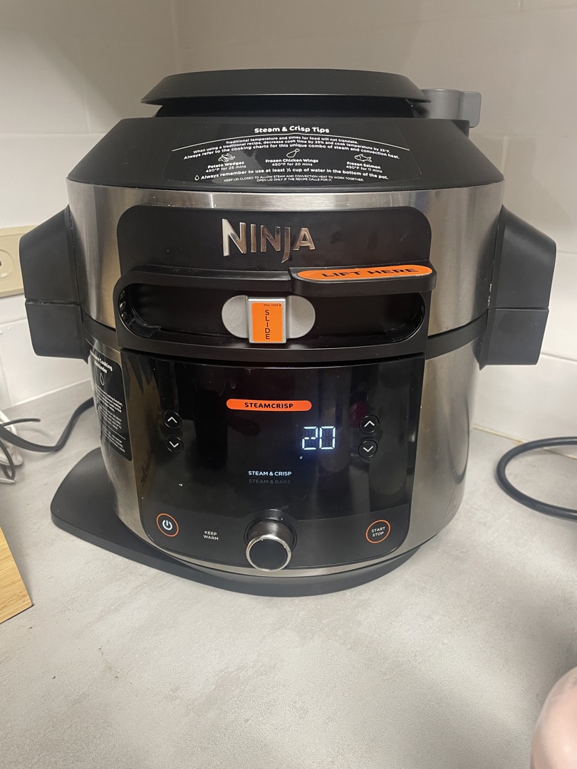  Ninja OL501 Foodi 6.5 Qt. 14-in-1 Pressure Cooker Steam Fryer  with SmartLid, that Air Fries, Proofs & More, with 2-Layer Capacity, 4.6  Qt. Crisp Plate & 25 Recipes, Silver/Black